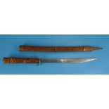 Sword with carved wood handle and sheath