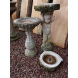 2 stone bird baths