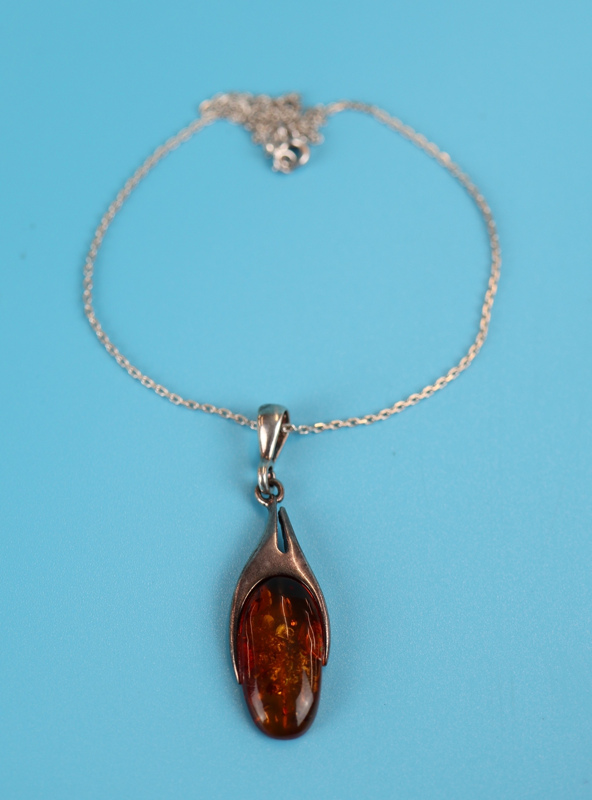 Silver & amber pendant on chain
