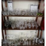 3 shelves of glass to include decanters and early etched examples