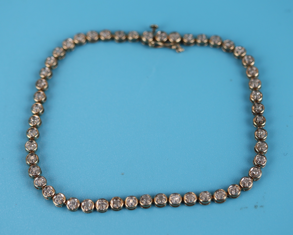 Gold diamond set tennis bracelet