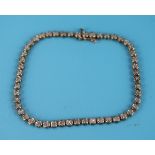 Gold diamond set tennis bracelet