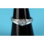 White gold diamond solitaire ring with diamond shoulders