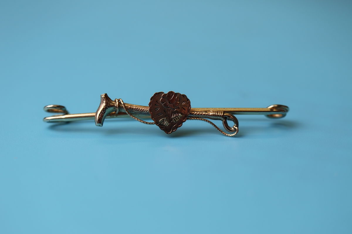 Antique gold riding crop & heart brooch