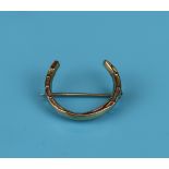 9ct gold horse shoe brooch