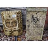 Stone sundial & Greenman plaques