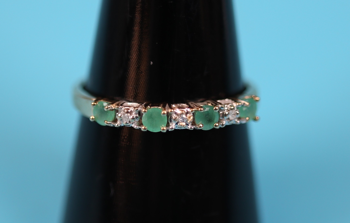 Gold emerald & diamond half hoop ring