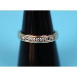 Gold channel set diamond ring