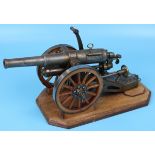 Good quality scale model field gun with machined steel barrel & chassis, detachable wheels on oak