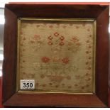 Sampler in oak frame