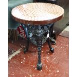 Heavy cast iron base pub table with 300 uncirculated 1967 pennies set in resin on top