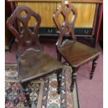 Pair of Gothic style mahogany hall chairs