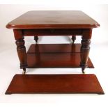 An Edwardian mahogany extending dining t