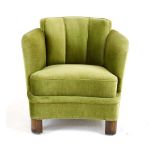 A 1930/40's green velour armchair with a