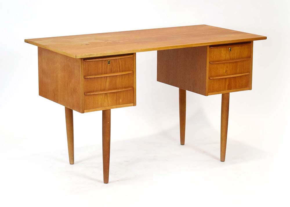 A 1960/70's teak and crossbanded desk wi