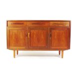 A G-Plan teak sideboard with an arrangem