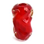 A 1960's Czech red glass vase of swirlin