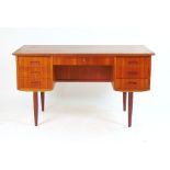 A 1960's teak and crossbanded desk with