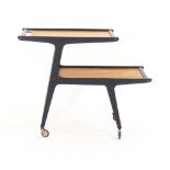 A 1960's teak and ebonised two-tier trol