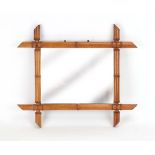 A 1950's French faux bamboo wall mirror,