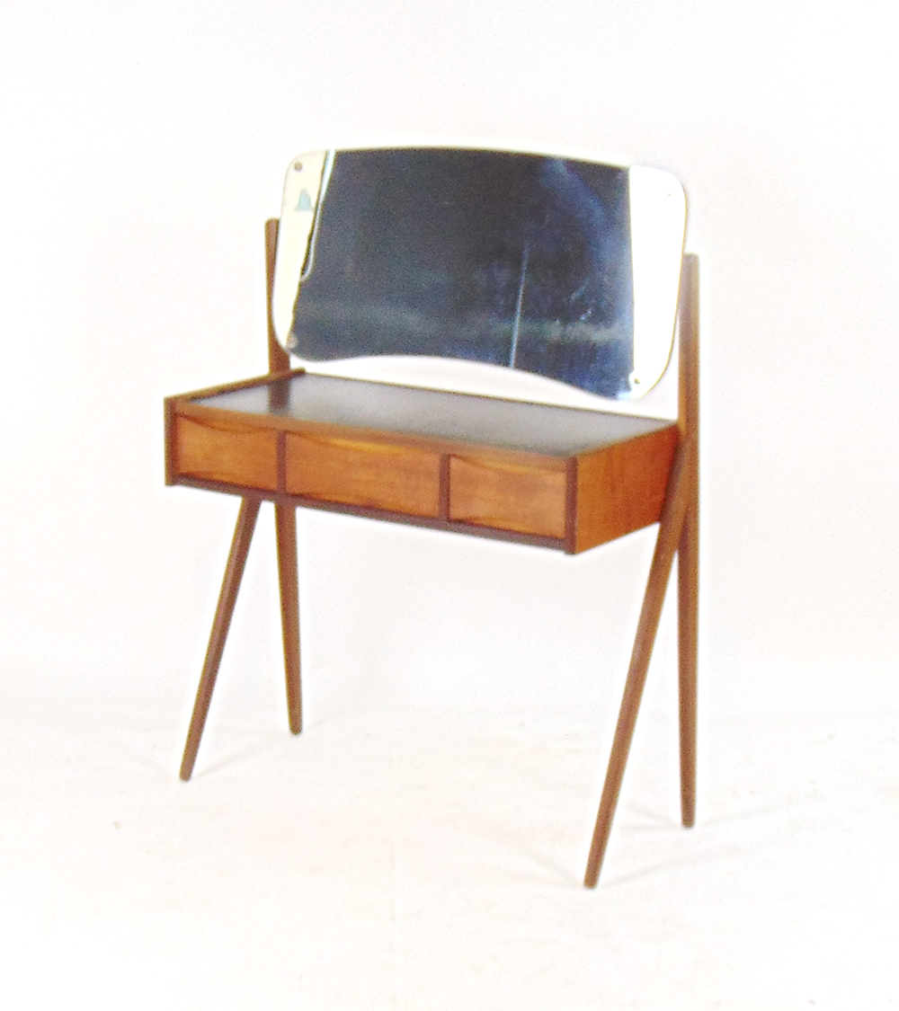 A 1970's teak dressing table, the shaped