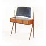 A 1970's teak dressing table, the shaped