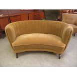 A 1940's mustard velour bow-fronted sofa