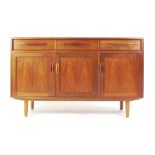 A G-Plan teak sideboard with an arrangem