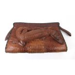 An early 20th century crocodile skin clu