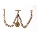 A 9ct gold double Albert chain with an e