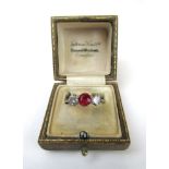 An early 20th century white metal, ruby