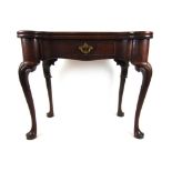 A George II mahogany tea table, the shap