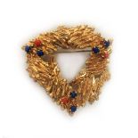 A 9ct gold bark design brooch with colou