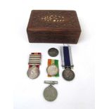 A collection of medals to include a Quee