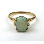 A yellow metal and opal solitaire ring,