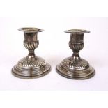 A pair of Victorian silver candlesticks