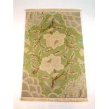 A handwoven Himalayan rug, the green gro