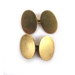 A pair of 9ct gold oval cufflinks. Appro