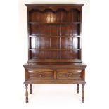 A reproduction oak 17th century style dr