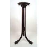 An early 19th century mahogany torchere