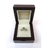 An 18ct yellow gold, emerald and diamond