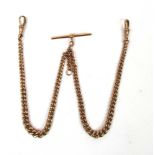 A 9ct rose gold double Albert chain havi