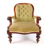 A 19th century mahogany nursing chair up