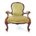 A Victorian mahogany nursing chair uphol