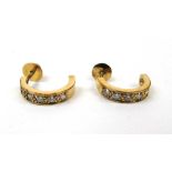 A pair of yellow metal and diamond half