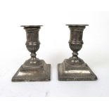 A pair of Victorian silver candlesticks