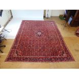 A handwoven Persian rug, the multi line