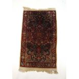 A handwoven Persian rug, the herati bord