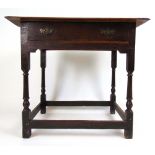 An early 18th century oak lowboy, the mo