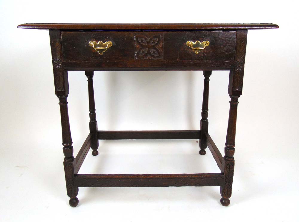 An 18th century and later oak single dra